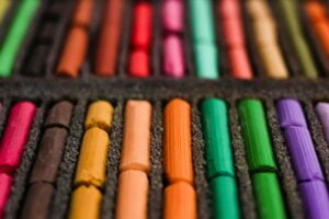 Multicolored artists soft pastels, chalks, crayons. Spectrum of colors. Background. N