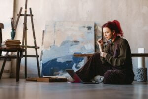 Young white woman painter in an art studio